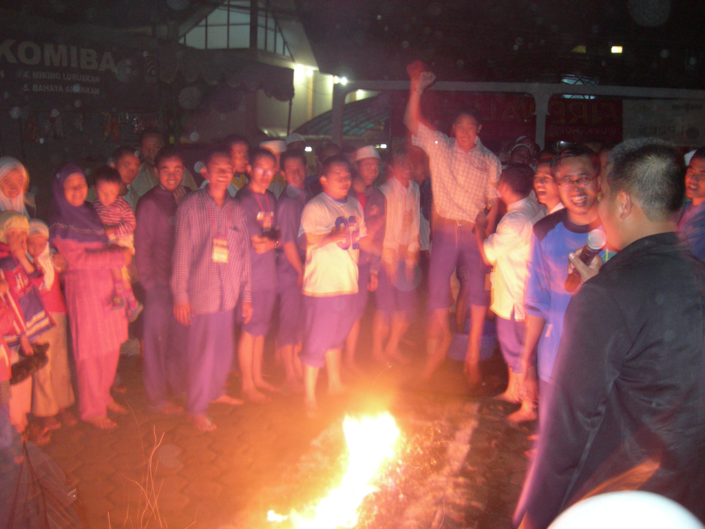 A group of people gathered around a fire