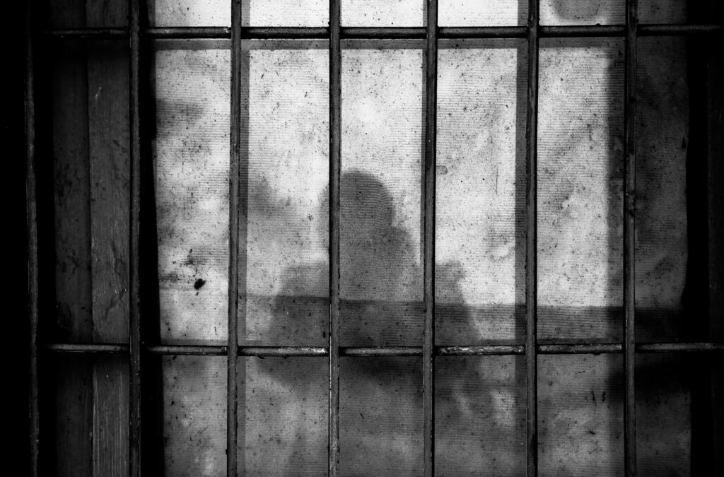Shadow behind bars