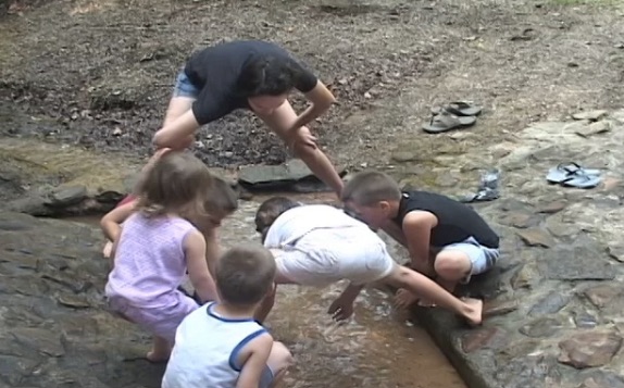 Four kids playing in water