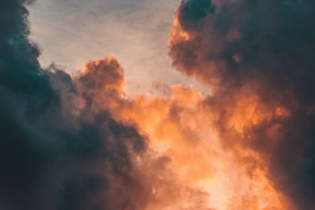Fiery light appears between two dark clouds